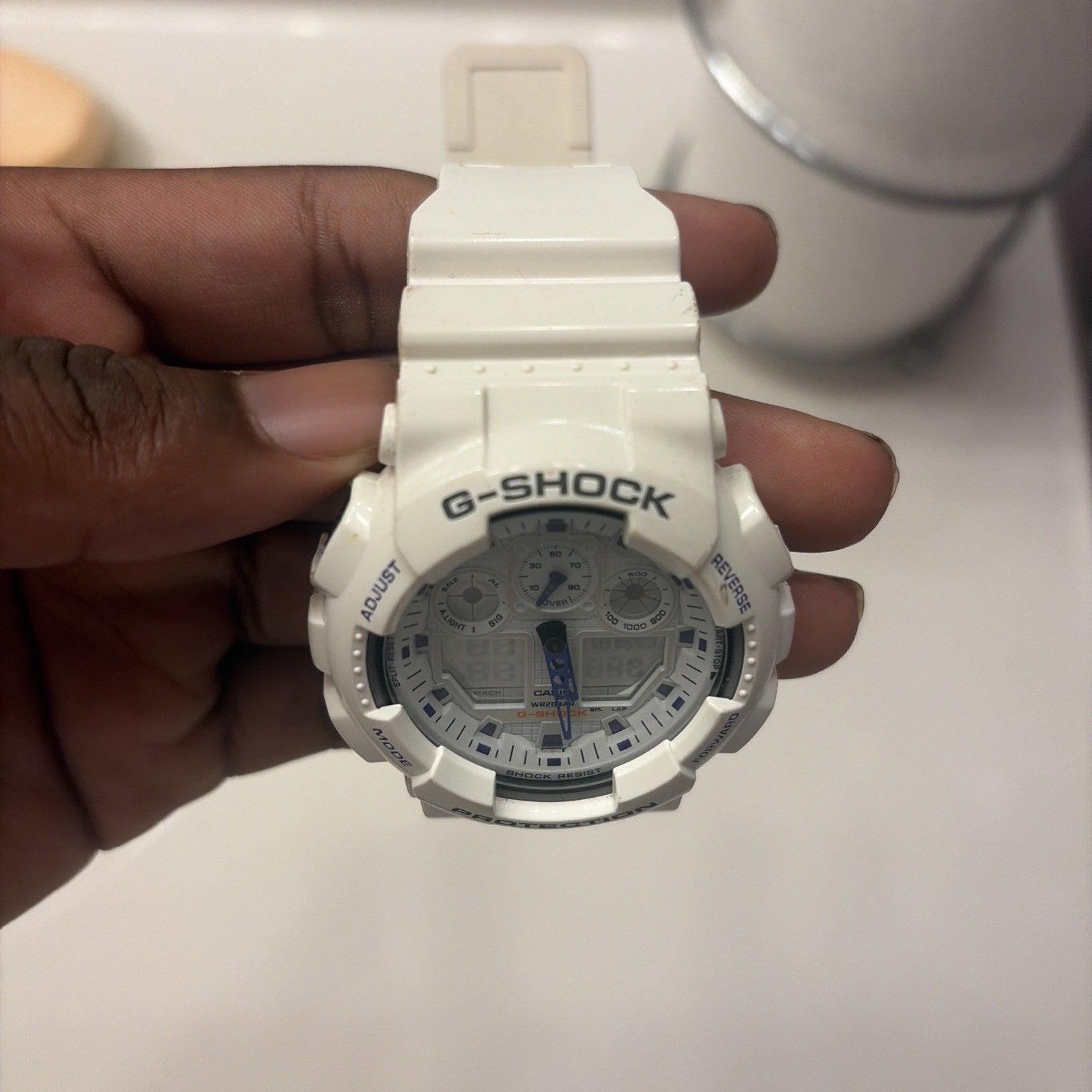 Casio G-SHOCK GA-100A White / Purple Analog-Digital Shock-Resistant Watch 200m