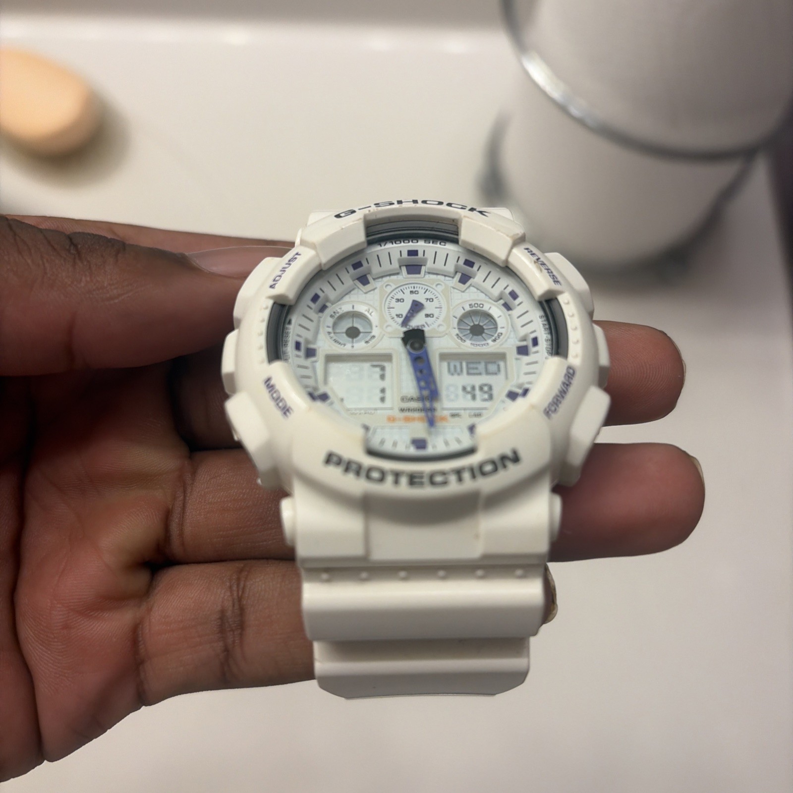 Casio G-SHOCK GA-100A White / Purple Analog-Digital Shock-Resistant Watch 200m