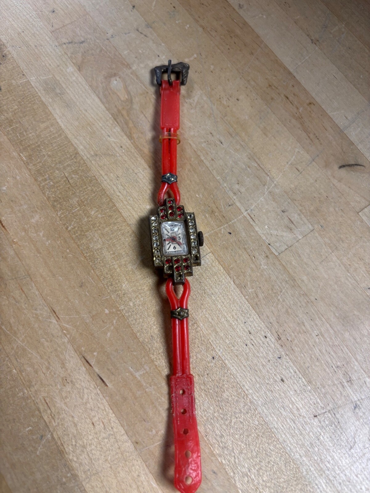 ANTIQUE TOY WATCH WITH PLASTIC BAND