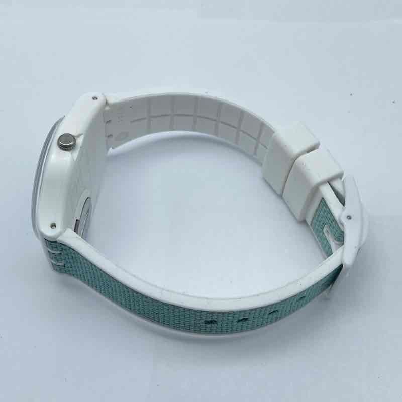 Swatch GW714 Pool Light 34mm Teal Dial Day Date Swiss Quartz Women’s Watch