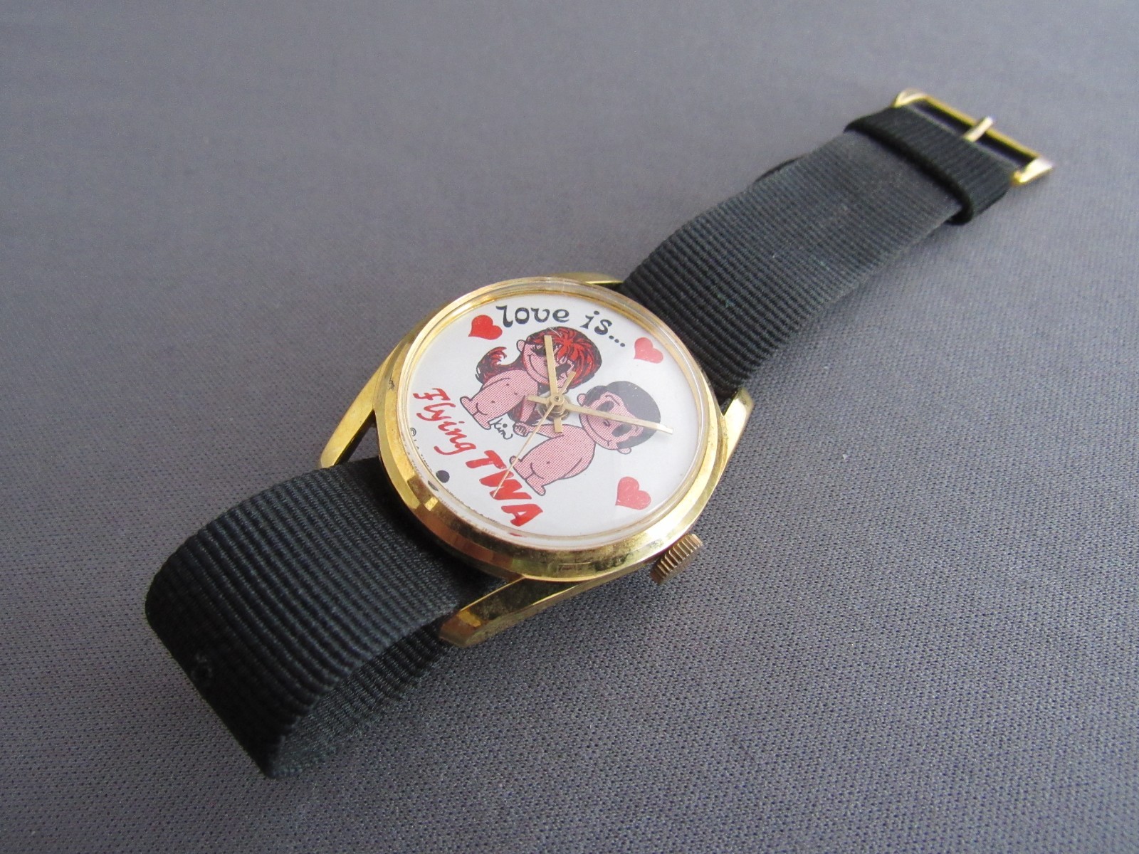 VINTAGE HONG KONG LOVE IS… FLYING TWA NONWORKING WINDING PROMO WRISTWATCH