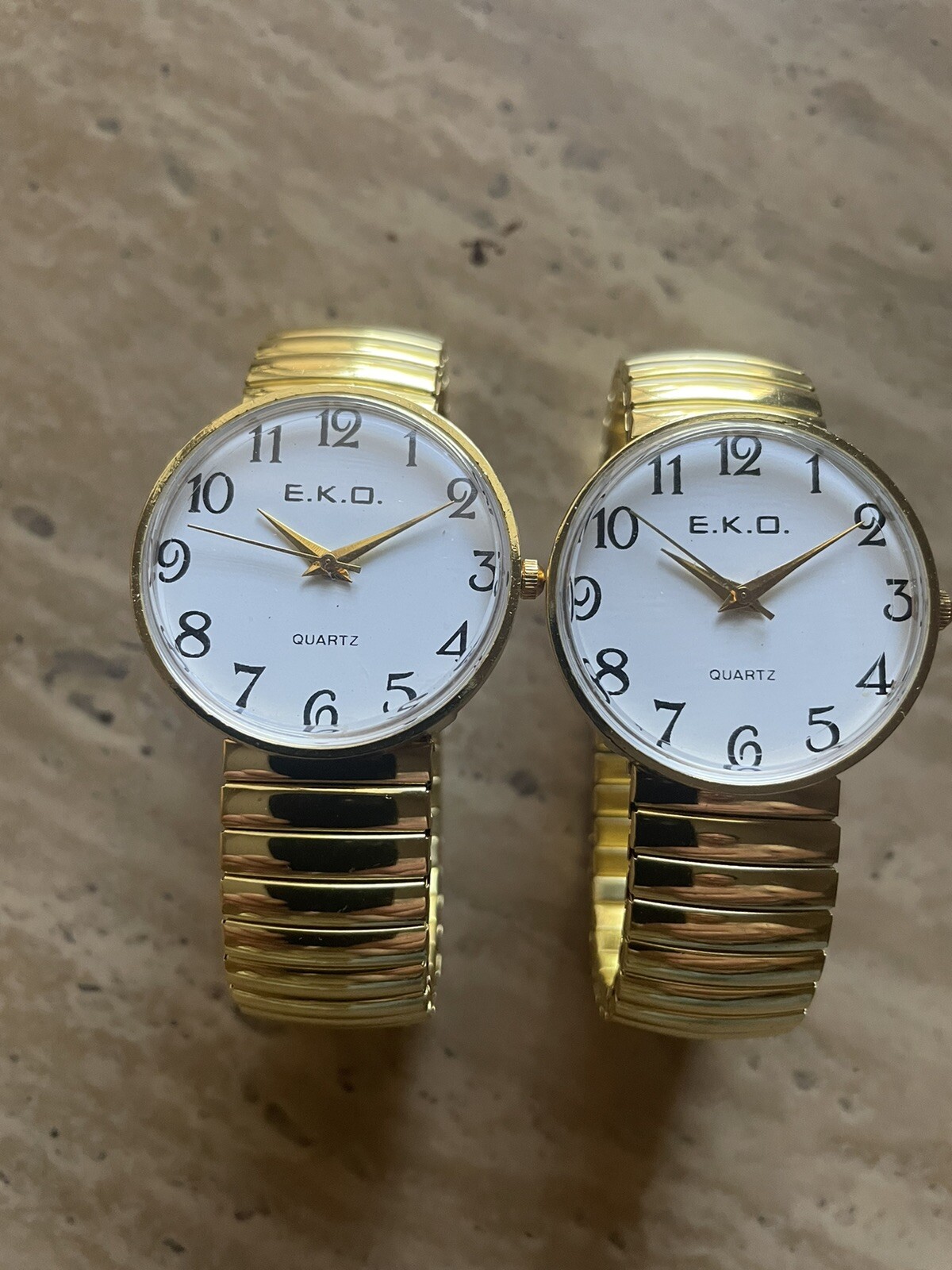 Buyer Gets 2 Unisex stretch Gold quartz Watches with LARGE EASY TO READ NUMBERS